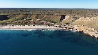 Drones are perfect to capture an extablishing shot for a picture story. This one paints a perfect picture of the camping grounds at Red Bluff nestled between the deep blue ocean and the arid country beyond.