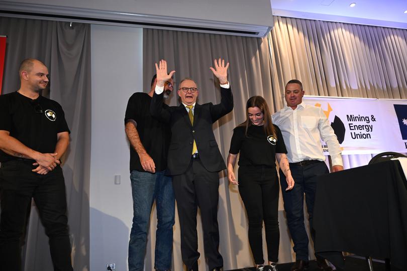 Australian Prime Minister Anthony Albanese acknowledges the audience after stumbling off the stage while attending an MEU conference in the electorate of Hunter on Day 6 of the 2025 federal election campaign, in the Hunter Valley, Thursday, April 3, 2025.