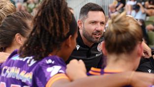 Stephen Peters, head coach of the Glory addresses his players.