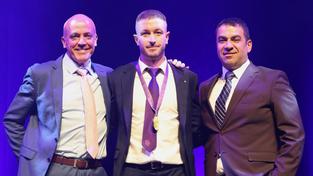 Perth Glory captain Adam Taggart (centre) with Mark Reid of La Vida Homes (left) and club chairman Ross Pelligra.