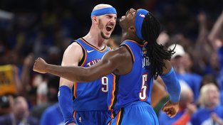 Alex Caruso and Luguentz Dort celebrate during the Game 7 win.