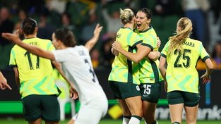 Emily Gielnik of Australia celebrates with teammate Alanna Kennedy after scoring the teams first goal during the International Friendly match between Australia Matildas and Slovenia at HBF Park on June 26 in Perth.